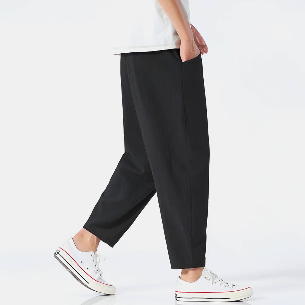 Men's black cropped trousers – side view