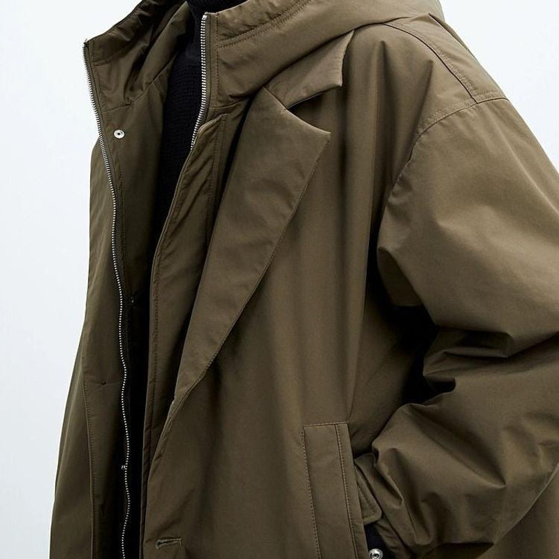 Man wearing the army green hooded parka – close-up