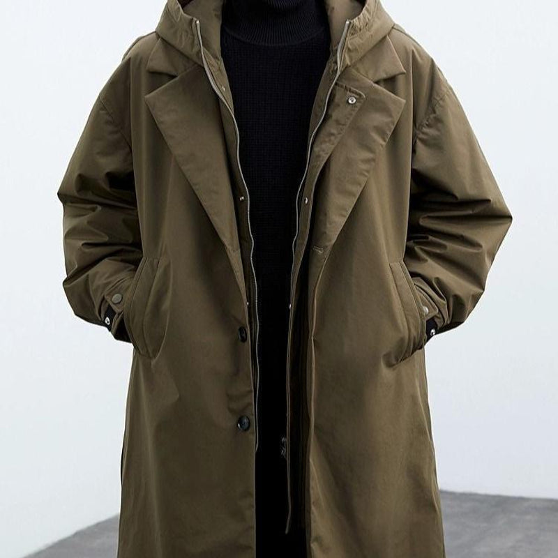 Man wearing the army green hooded parka – side view
