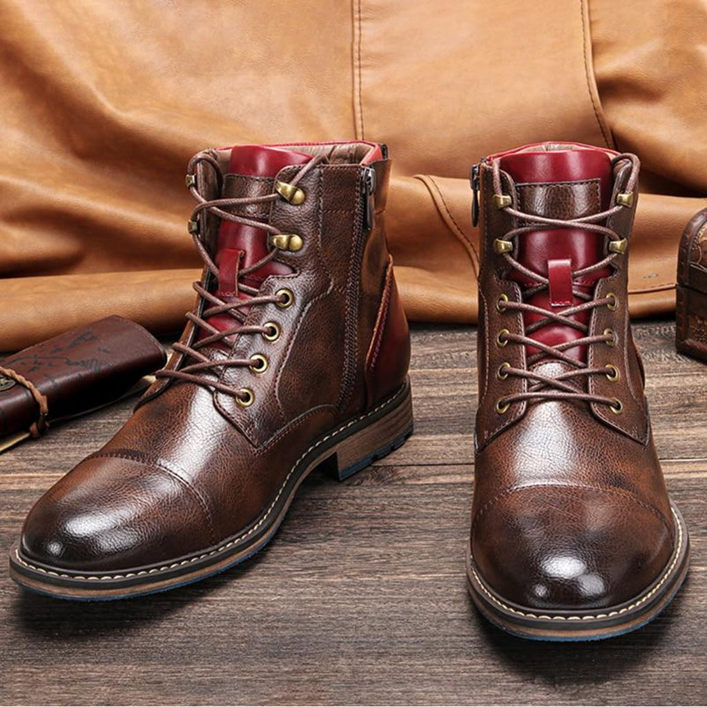 Pair of men's brown lace-up ankle boots with burgundy accents