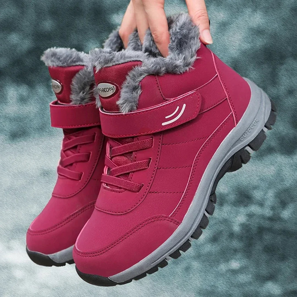 Man holding a red winter boot by the collar