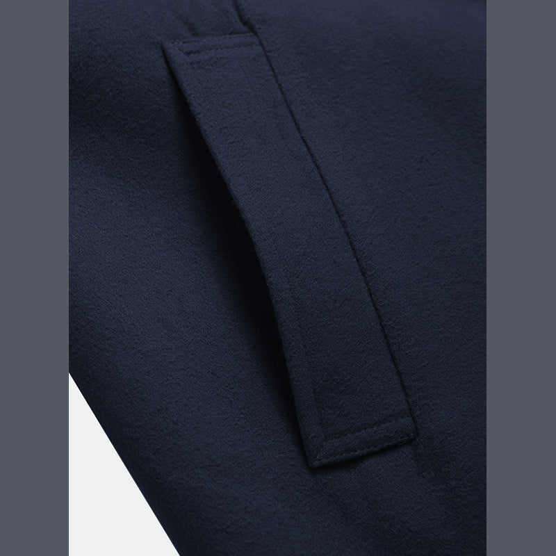 Close-up of the pocket on the navy overcoat