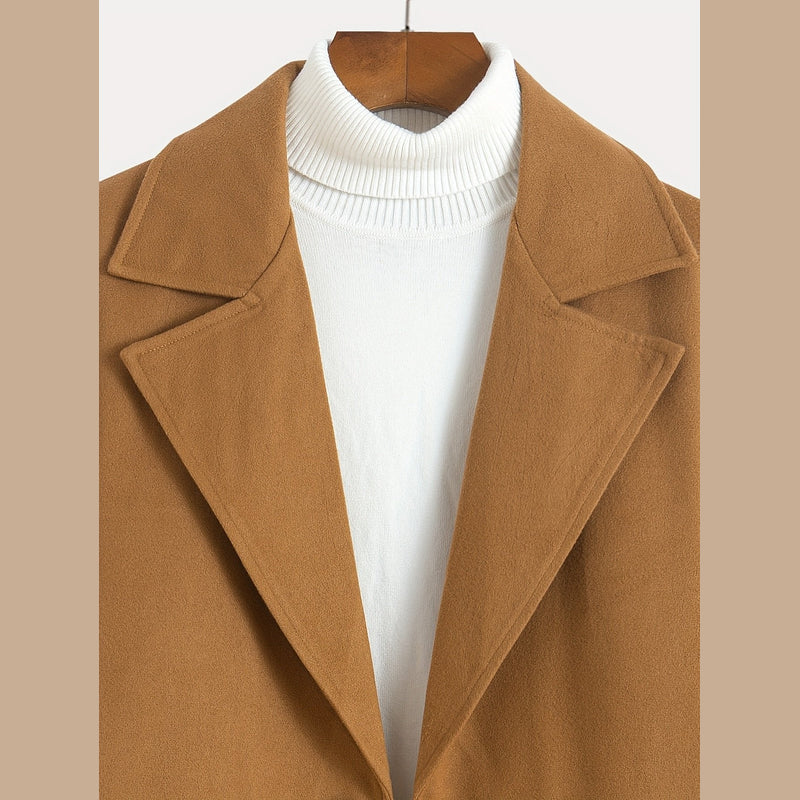 Close-up of the notched lapels on the brown overcoat