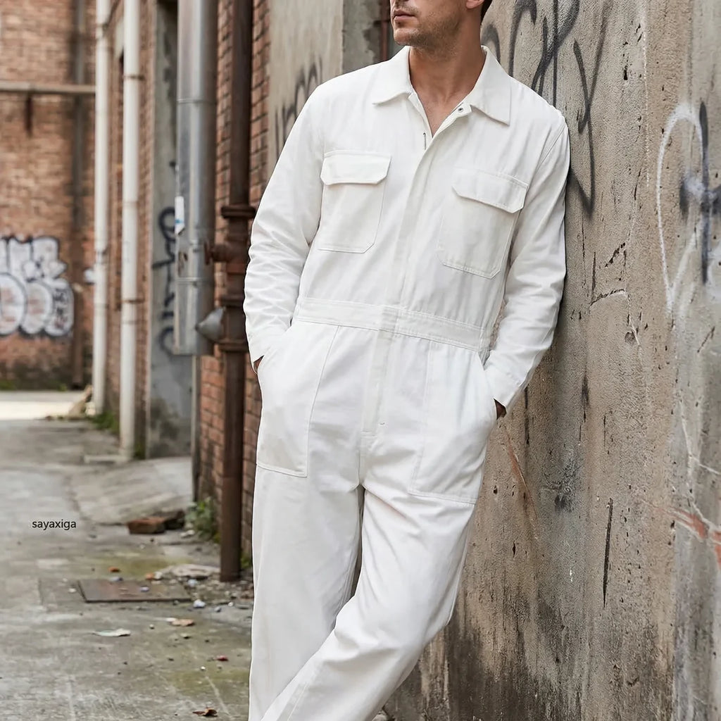 Man wearing a white long sleeve utility jumpsuit outdoors