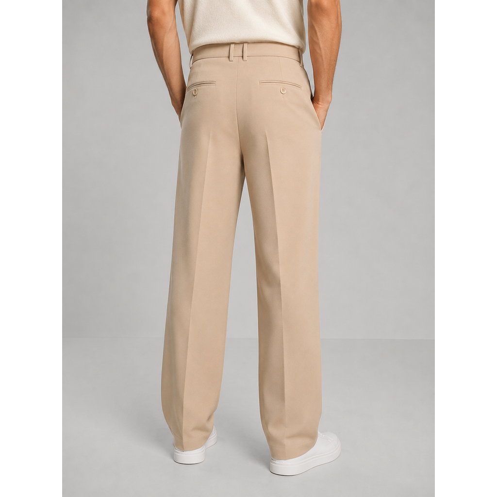 Men's beige pleated trousers with white trainers