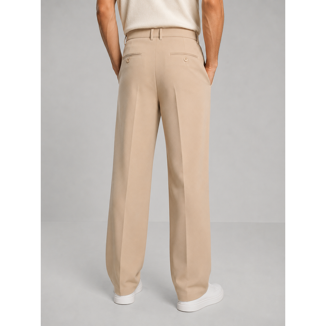 Men's beige pleated trousers with white trainers