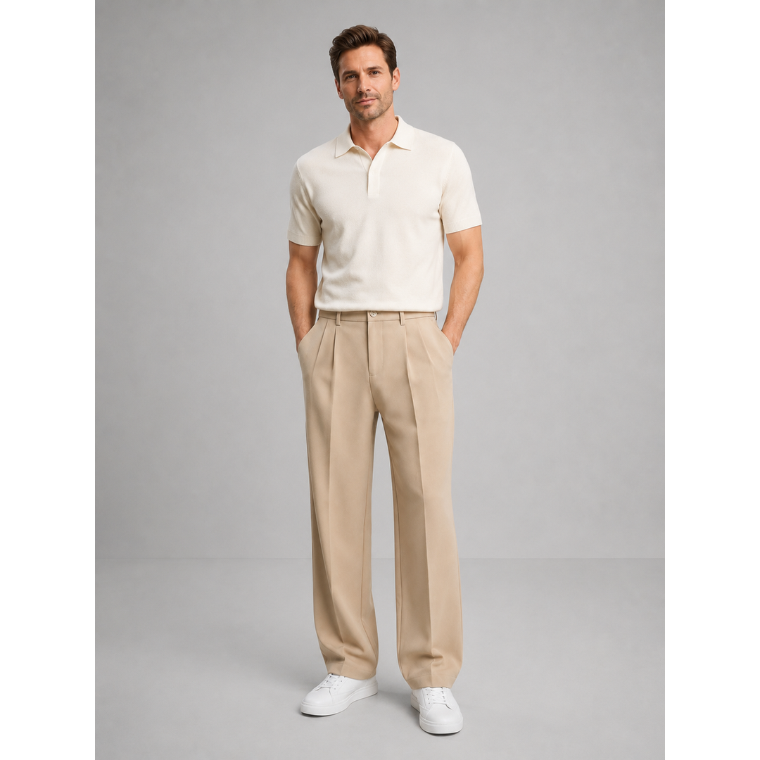 Man wearing beige pleated trousers with a cream polo