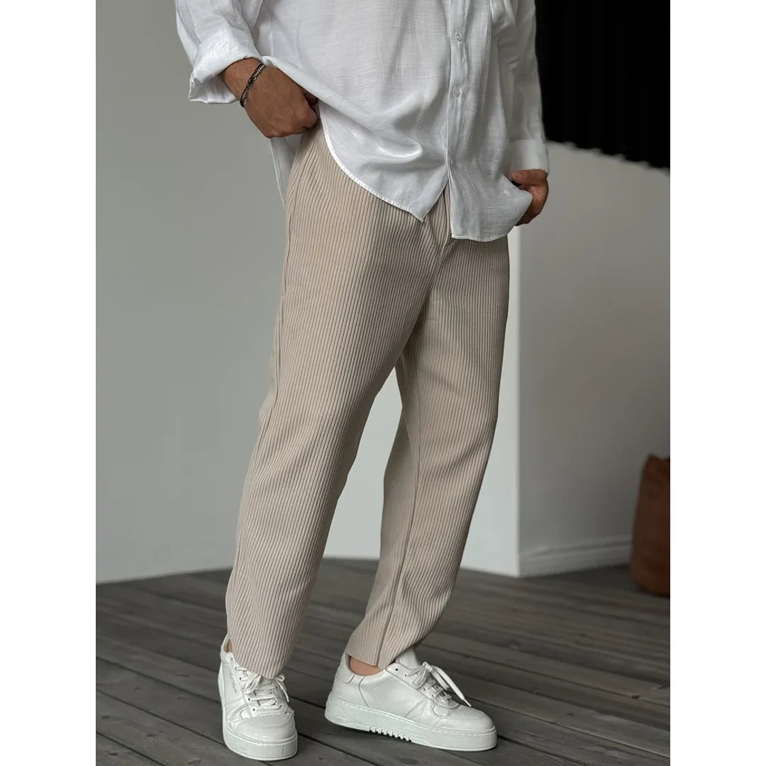 Men's beige relaxed trousers with white trainers