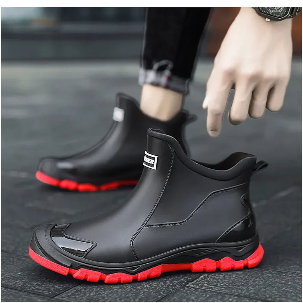 Man putting on black rain ankle boots