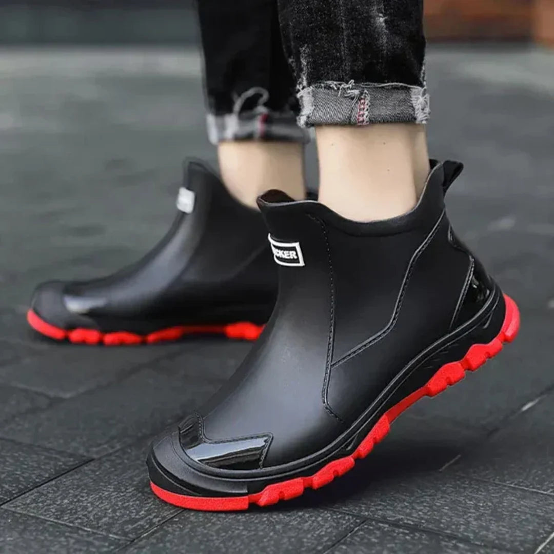 Men's black rain boots with red sole – close-up