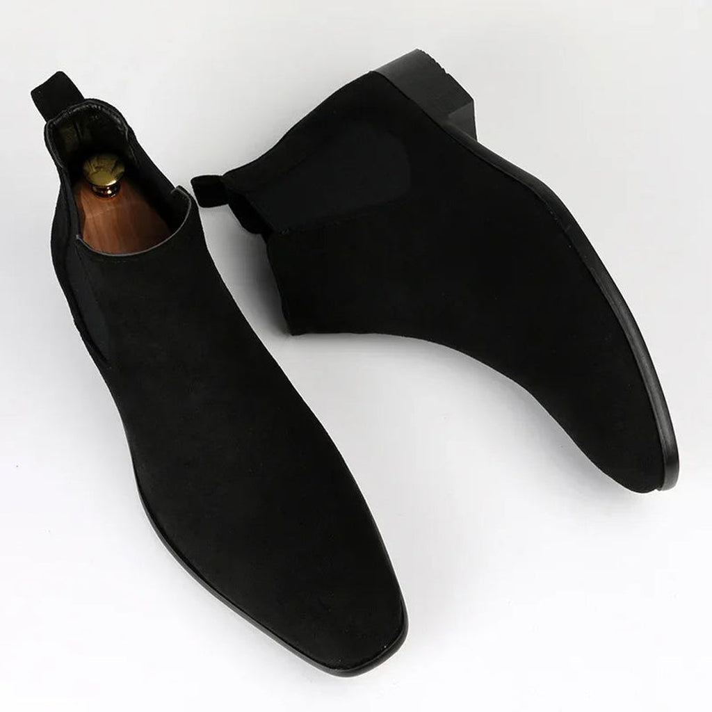 Pair of men's black Chelsea boots – top view