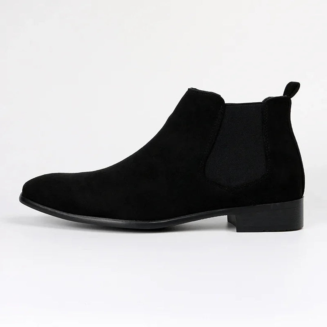 Men's black Chelsea boot with elastic side panel