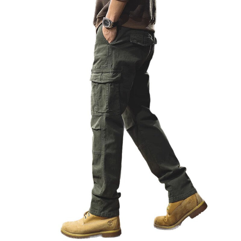 Man walking in army green cargo trousers – side view
