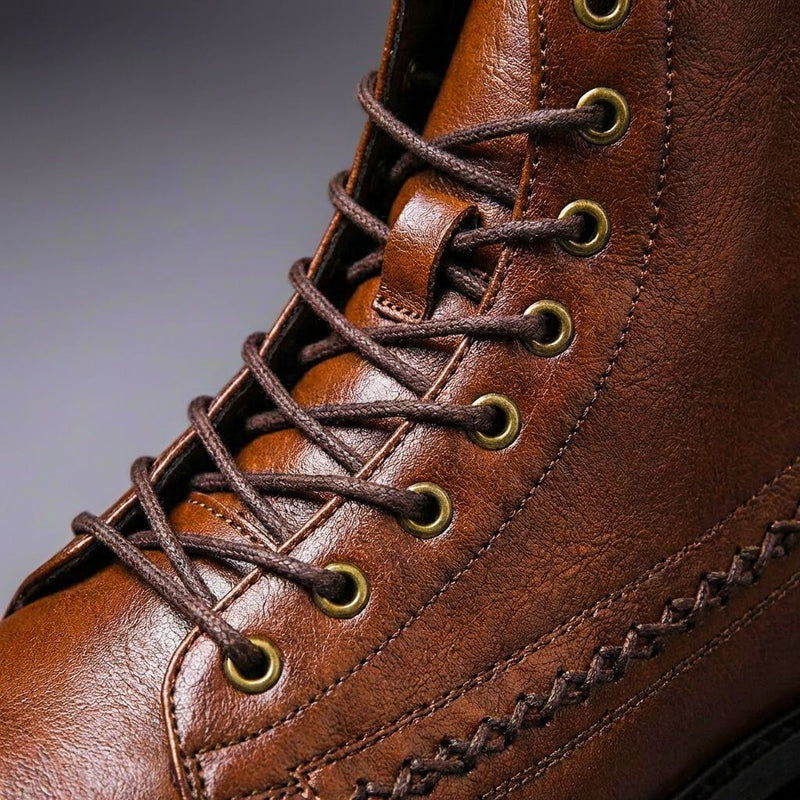 Close-up of brown boot lacing and stitching