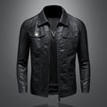 Black leather-look jacket with chest pockets on grey background