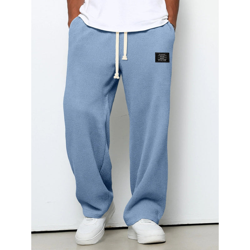 Men's relaxed fit drawstring trousers in light blue