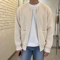Man wearing cream ribbed zip-up cardigan with pockets