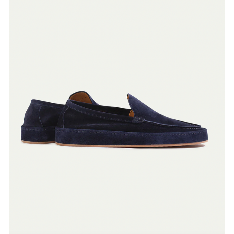Pair of navy men's slip-on loafers – side view
