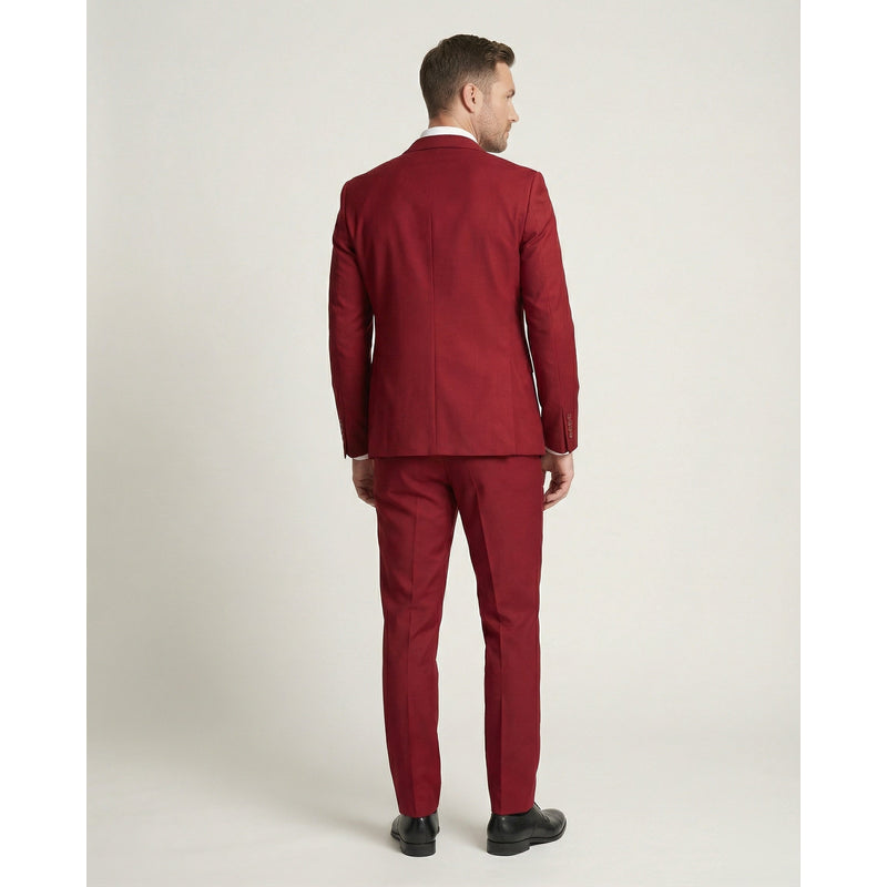Man in red three-piece suit – back view