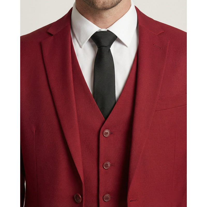 Close-up of red suit jacket and waistcoat with black tie
