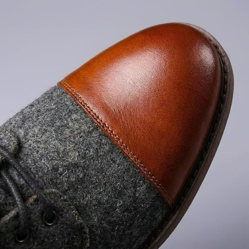 Close-up of brown toe cap on two-tone boot