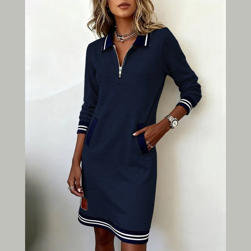 Woman wearing the navy collared dress – front view