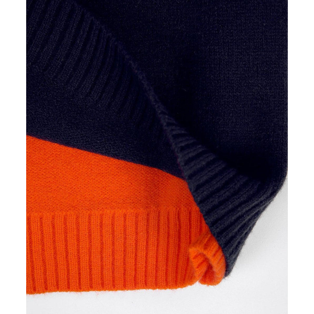 Close-up of the ribbed hem in navy and orange