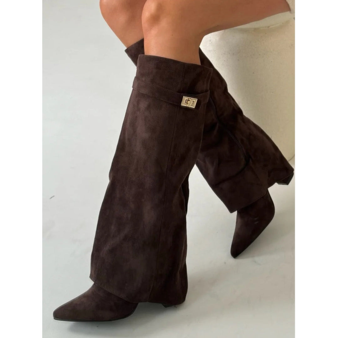 Woman sitting in dark brown fold-over boots