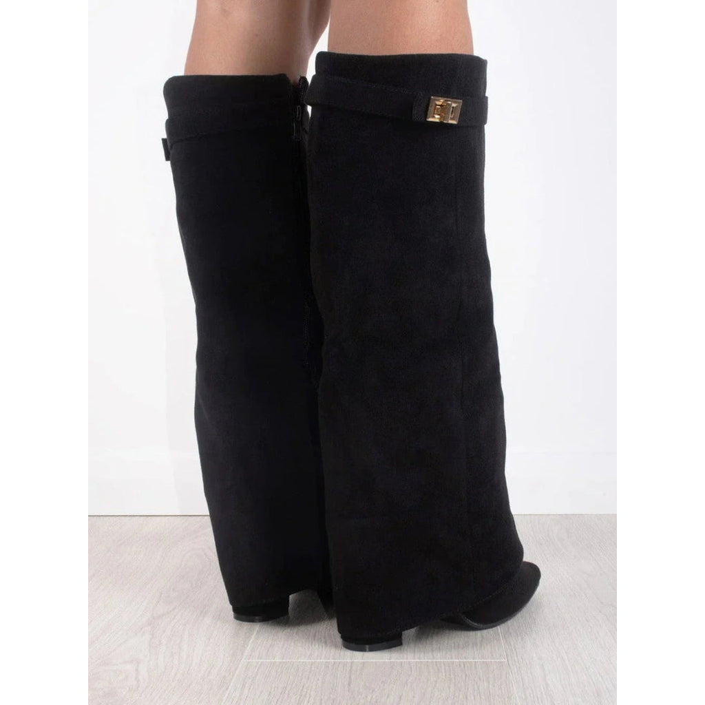 Close-up of the gold-tone detail on the black boots