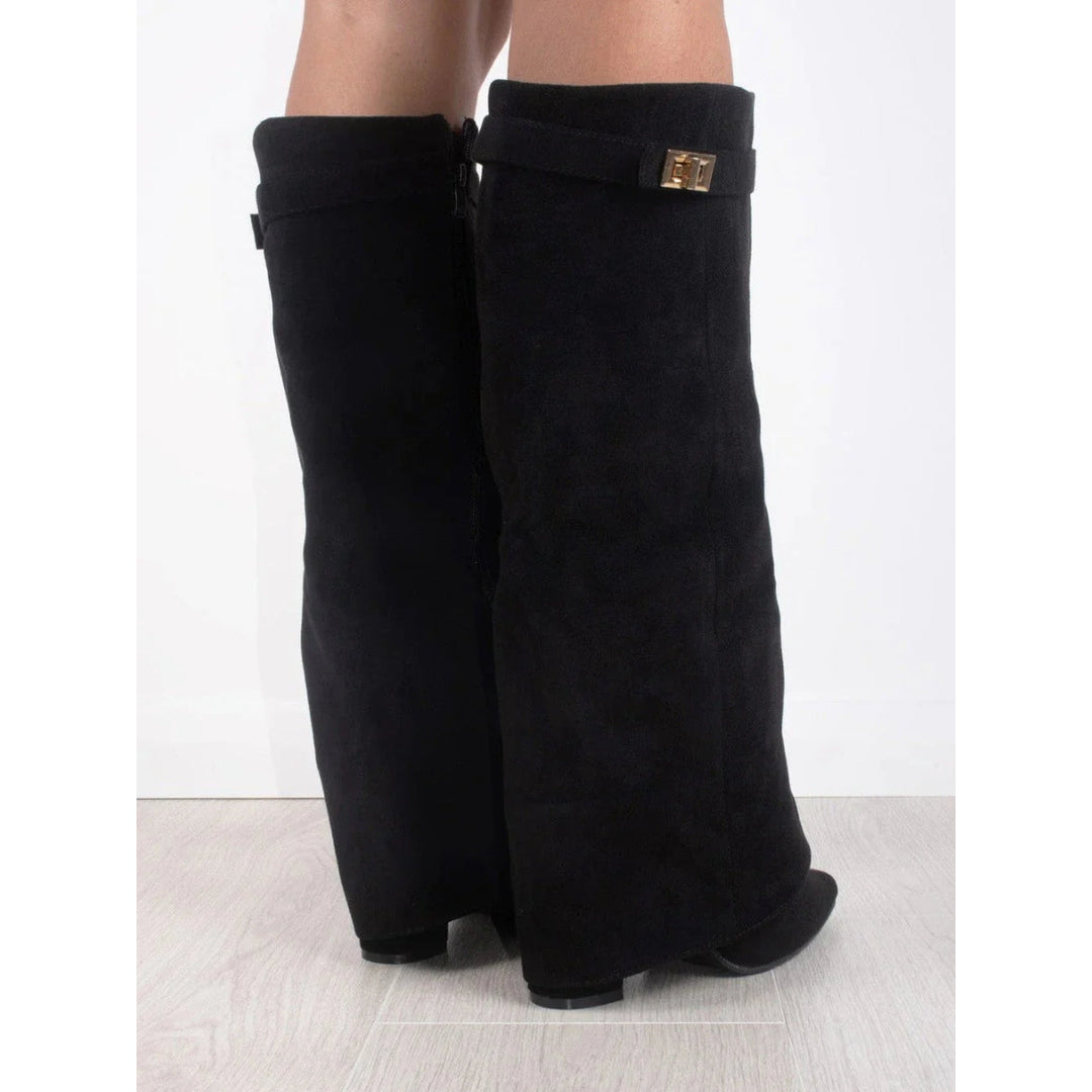 Close-up of the gold-tone detail on the black boots