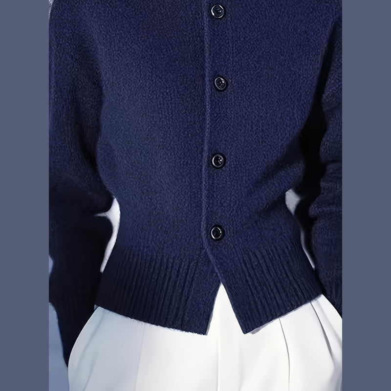 Close-up of the buttons on the navy cardigan