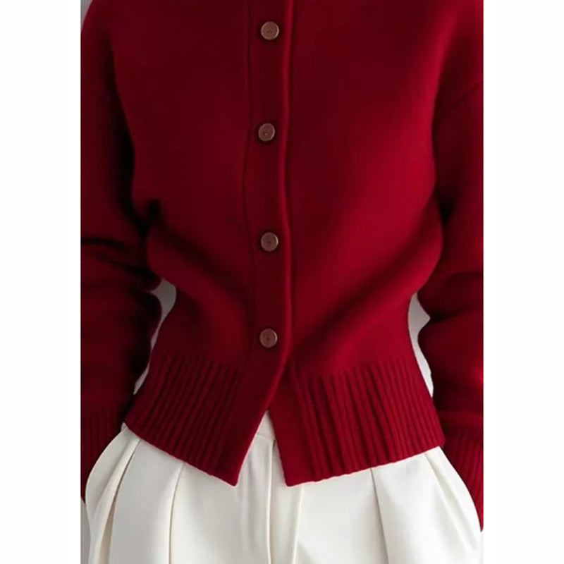 Close-up of the buttons on the red cardigan