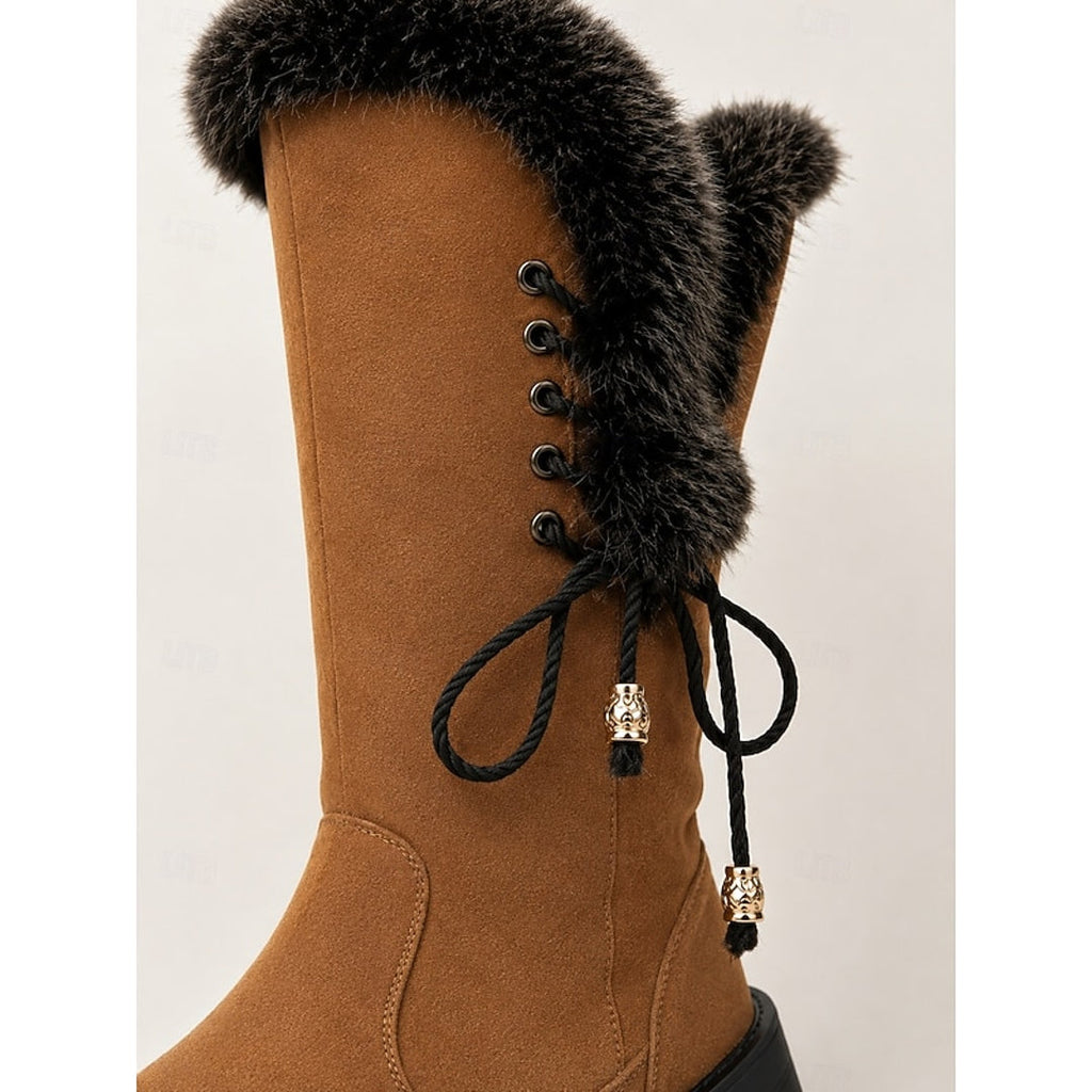 Close-up of the fluffy cuff and laces on the camel boot