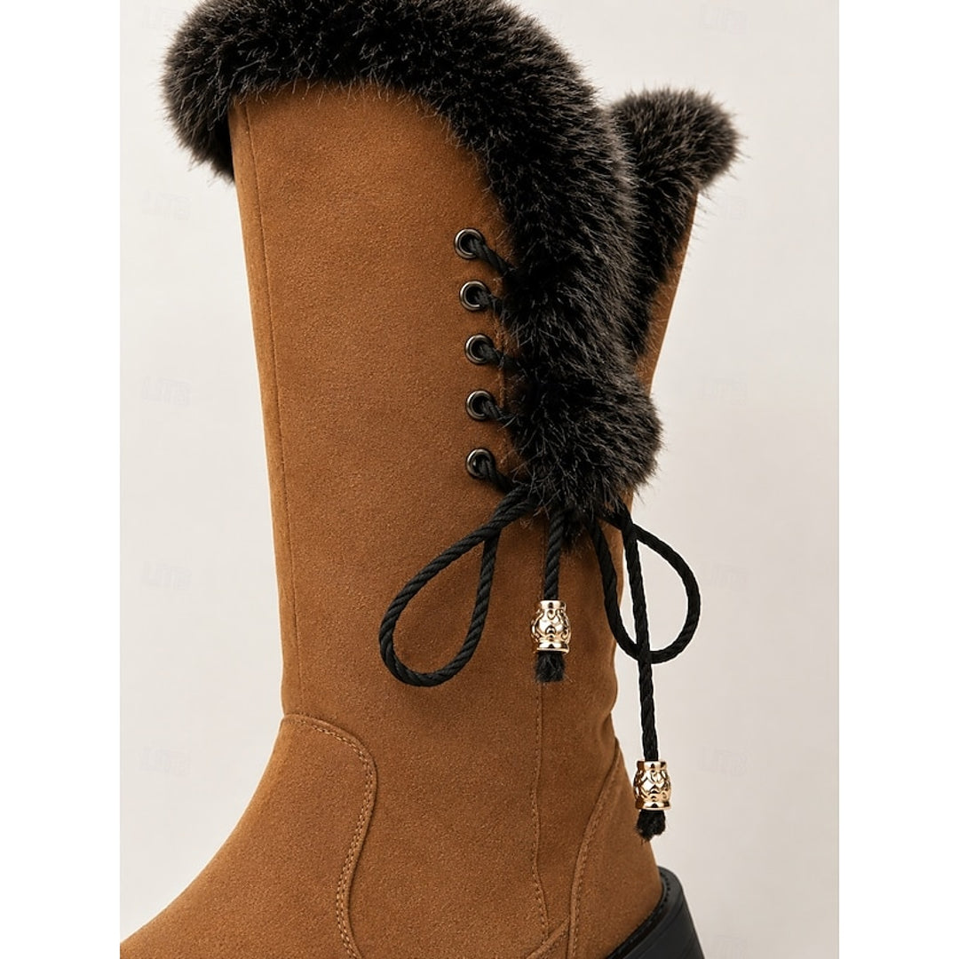 Close-up of the fluffy cuff and laces on the camel boot