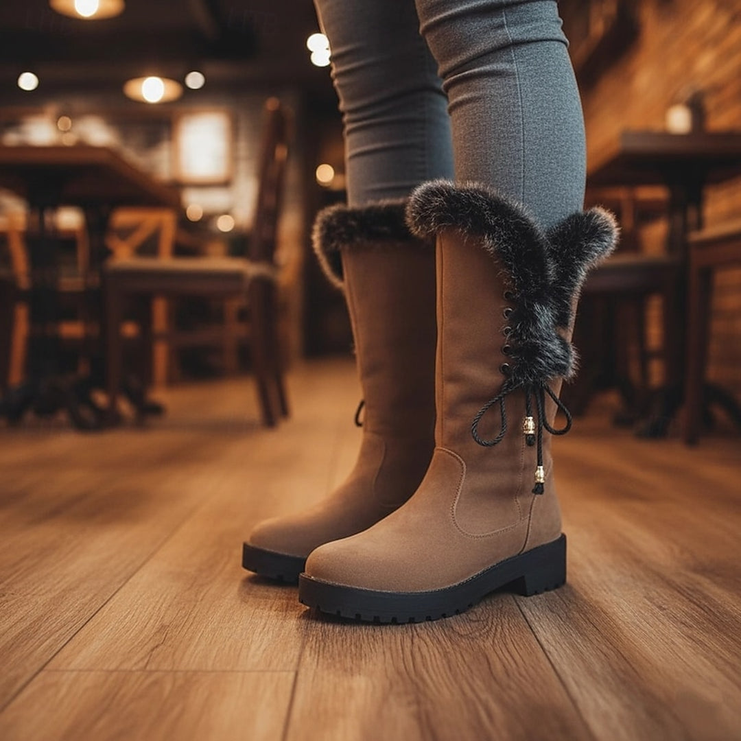 Women's camel winter boots worn indoors