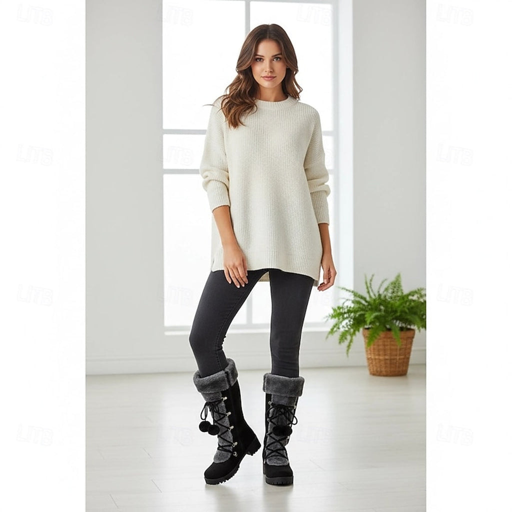 Woman wearing black lace-up winter boots indoors