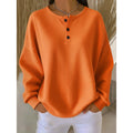 Women's oversized waffle henley pullover in orange