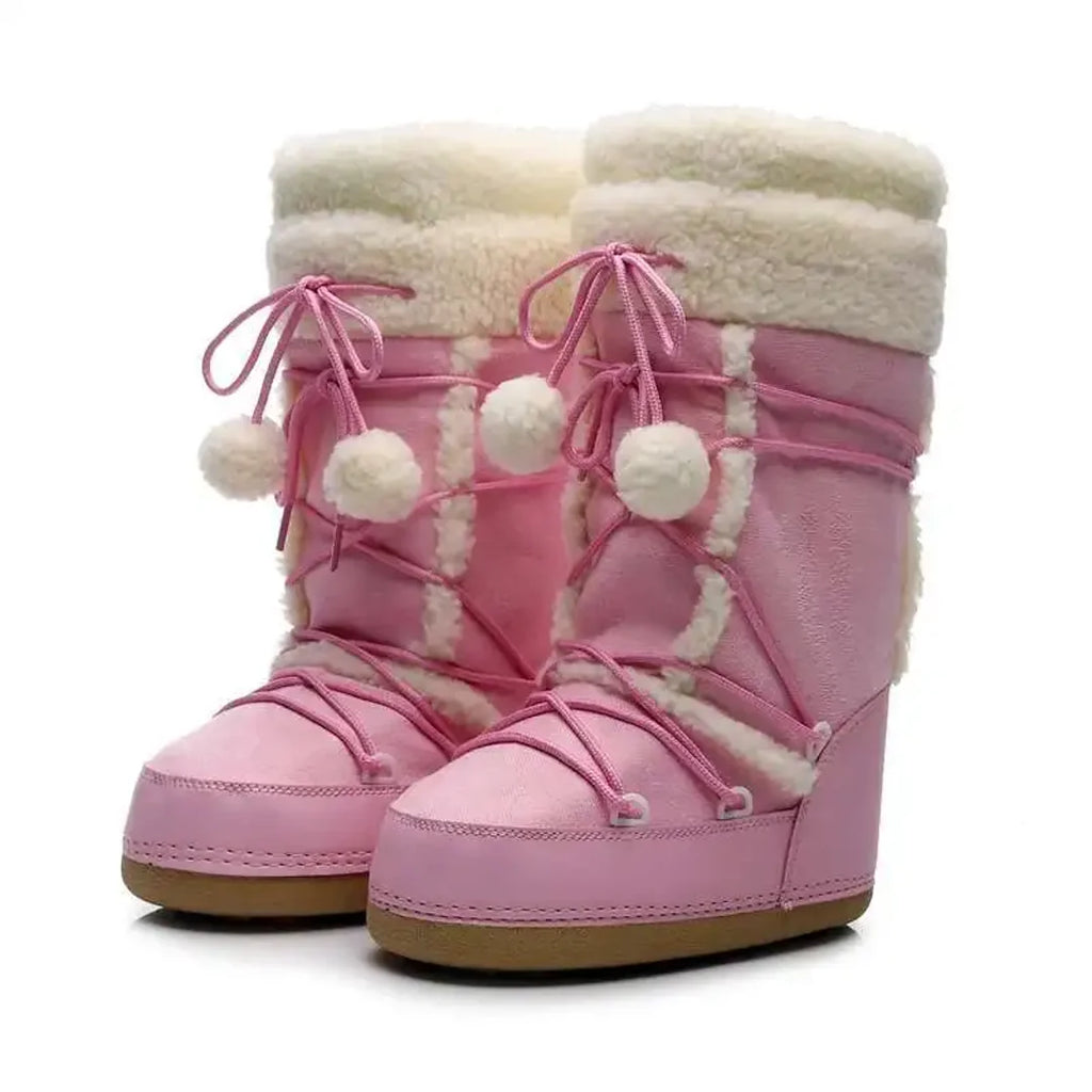 Pair of women's pink pom-pom snow boots