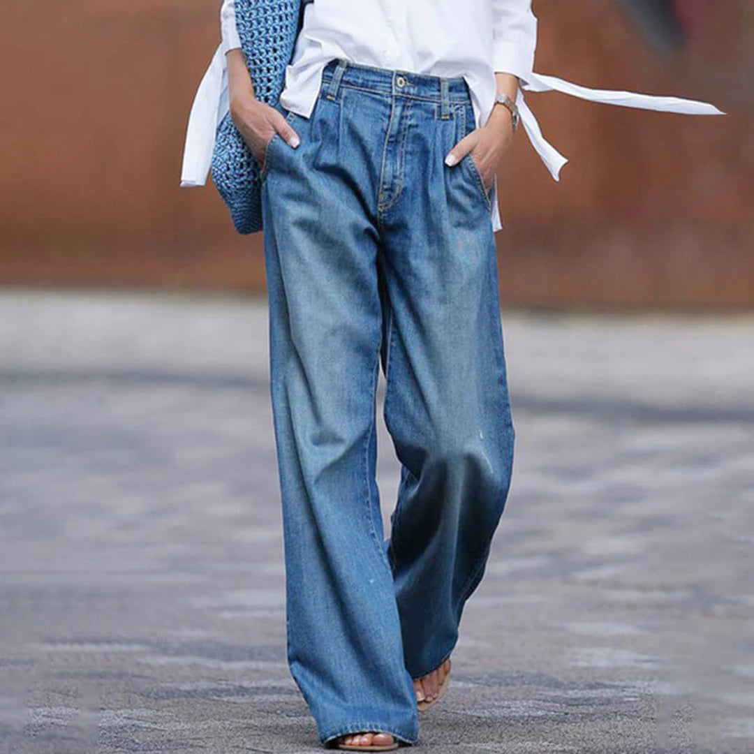 Woman wearing blue pleated wide-leg jeans