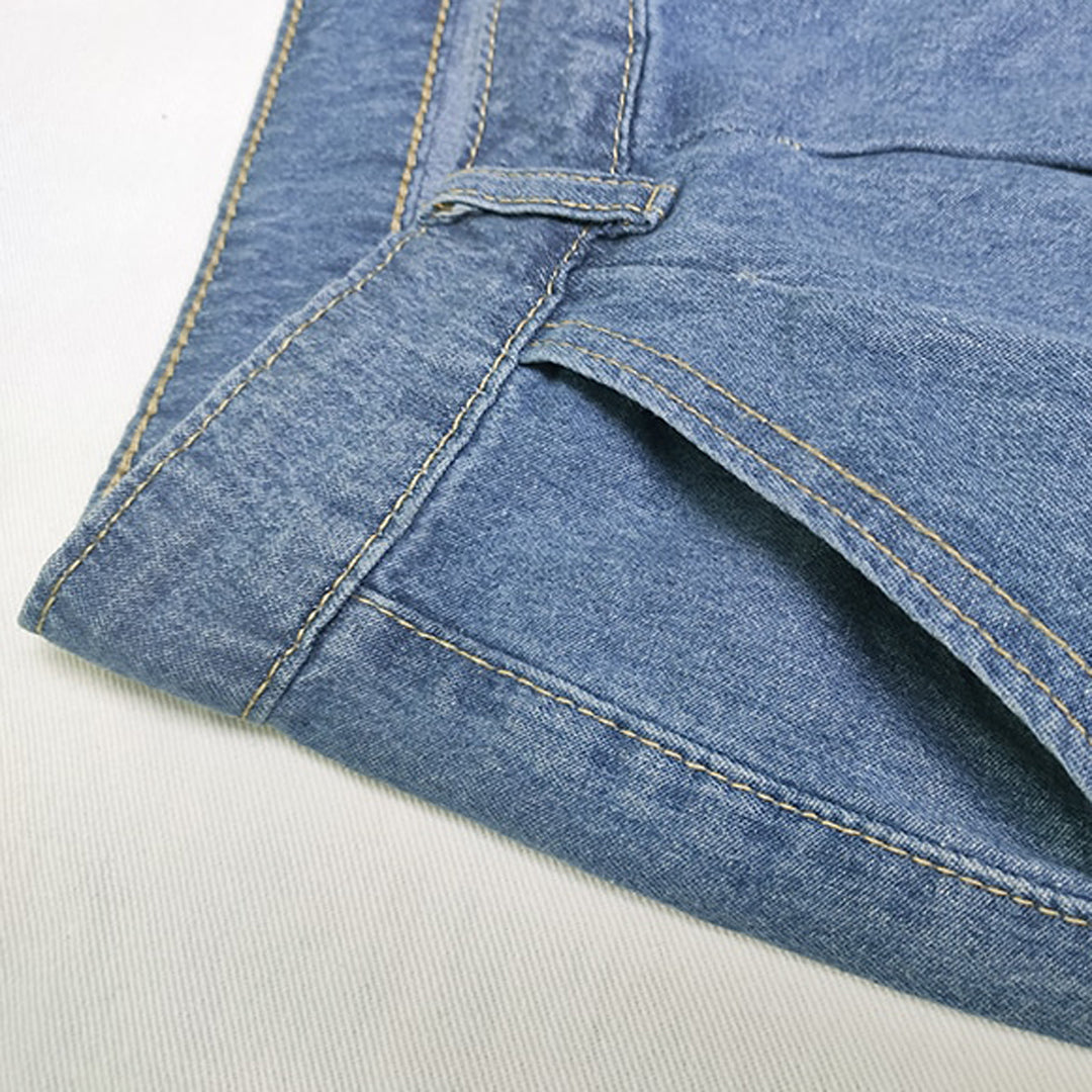 Close-up of the pleat and pocket on the blue wide-leg jeans