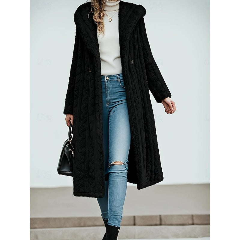 Woman wearing the black hooded longline coat