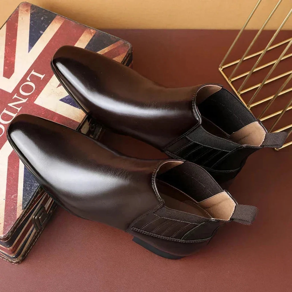 Women's glossy Chelsea boots on a gift box