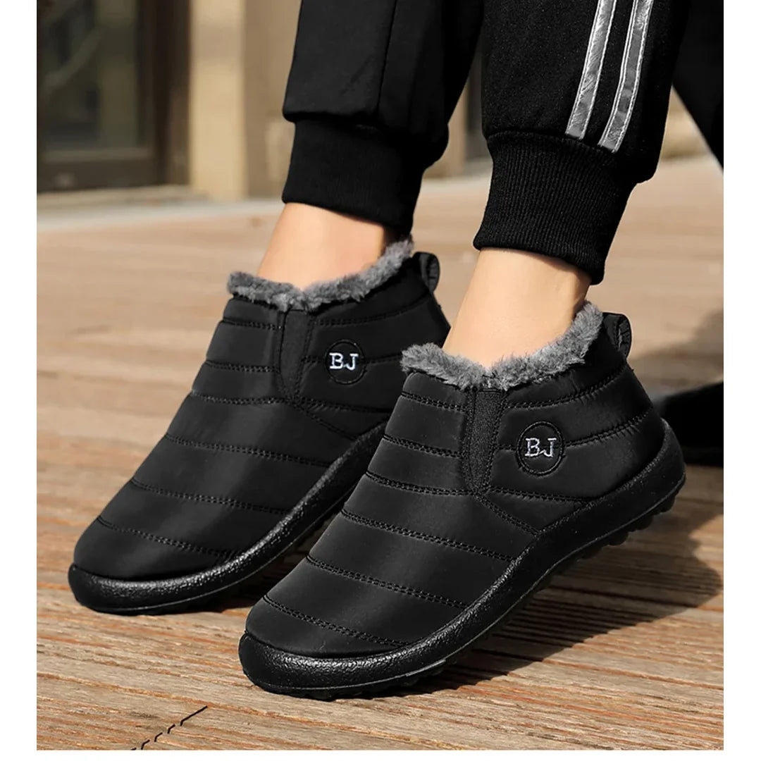 Woman wearing black quilted boots – side view
