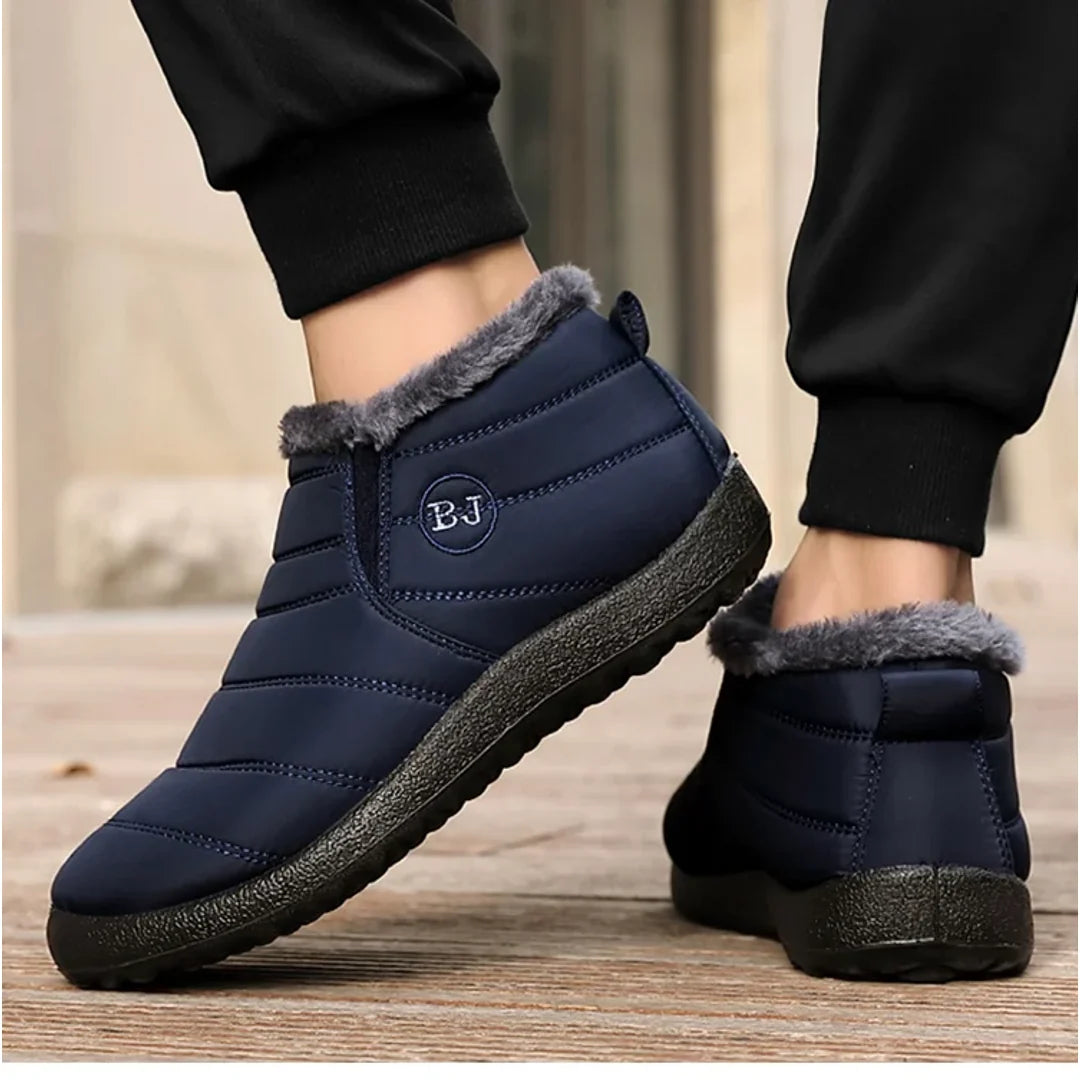 Woman wearing navy quilted ankle boots – side view
