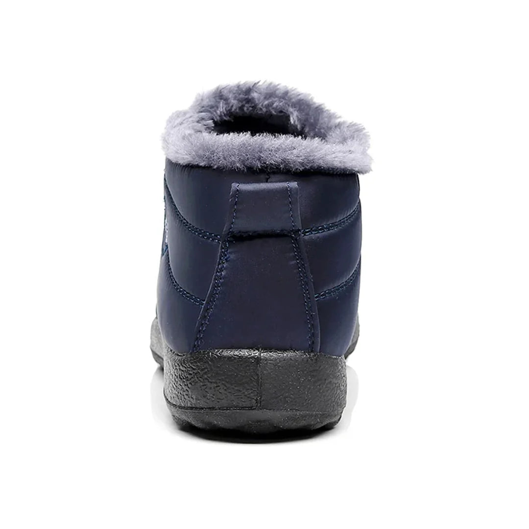Women's navy quilted ankle boot – back view with pull tab