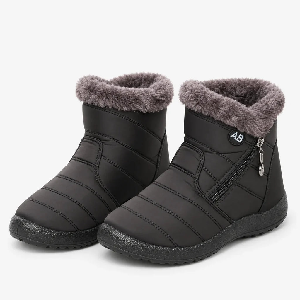 Pair of women's black quilted winter ankle boots