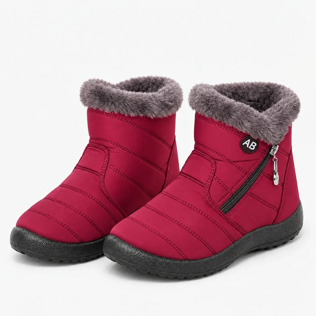 Pair of women's red quilted winter ankle boots