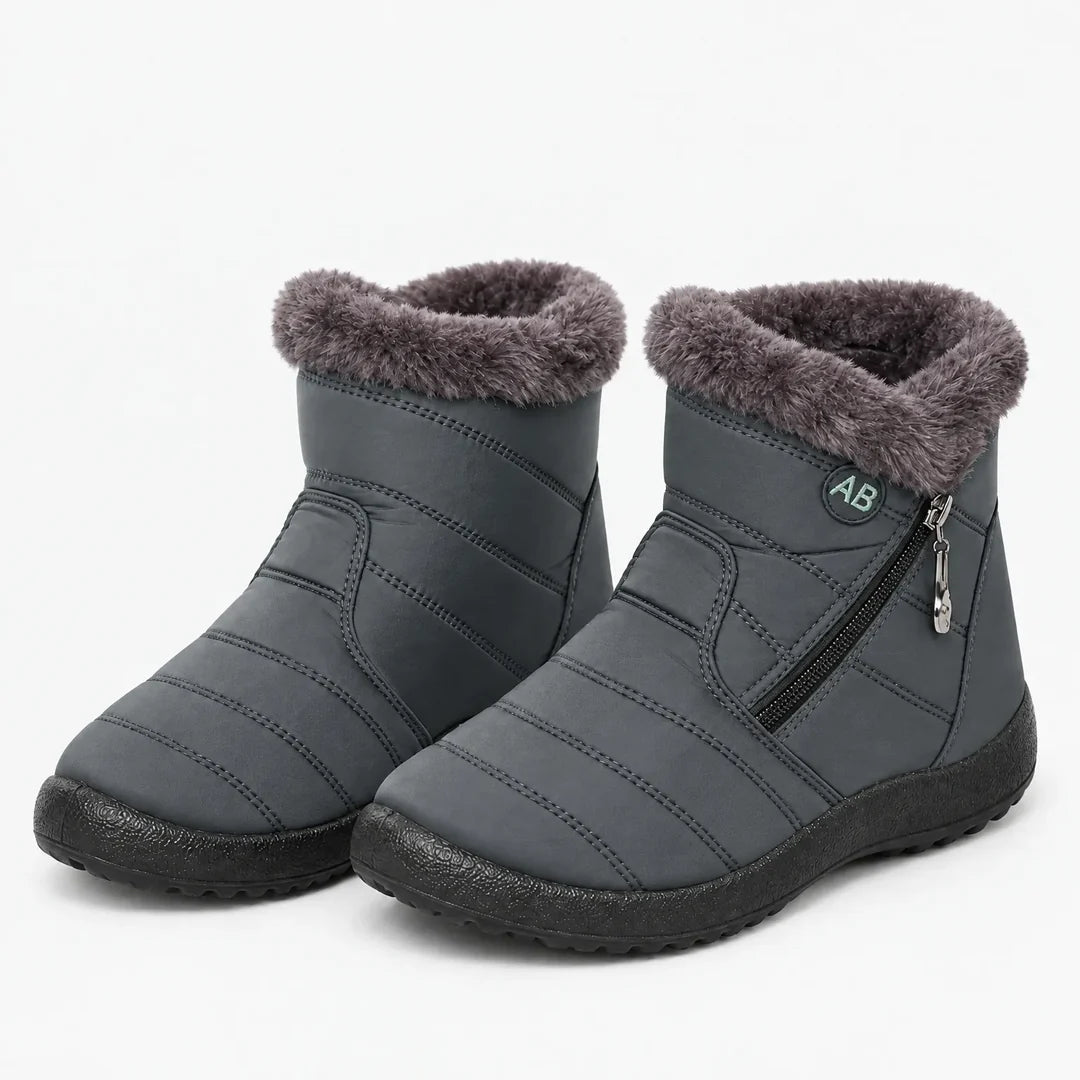 Pair of women's grey quilted winter ankle boots