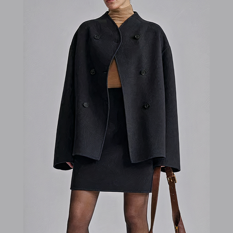 Woman wearing the black short coat – side view