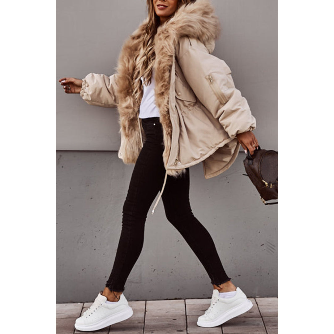 Woman walking in a beige short parka